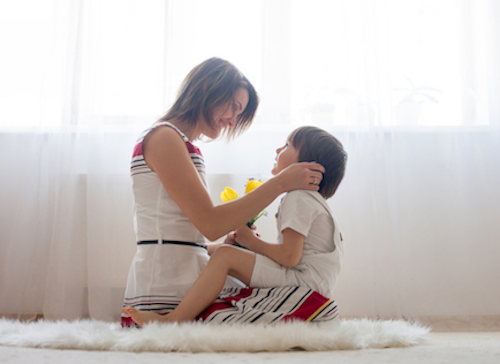 Mother and her child, embracing with tenderness and care